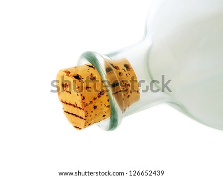 Empty glass half bottle with cork laying down on white background