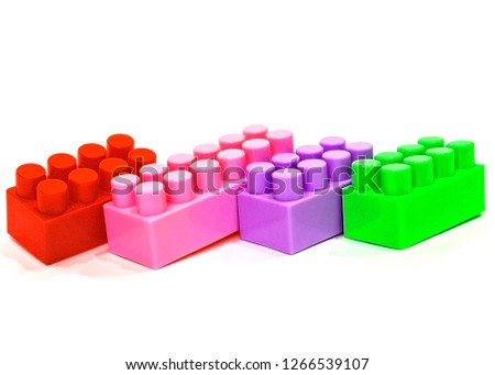 pictured in the photo details of a children's plastic constructor on a white background. colored cubes. block.