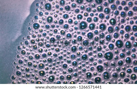 abstract textured background of blue water bubbles; macro