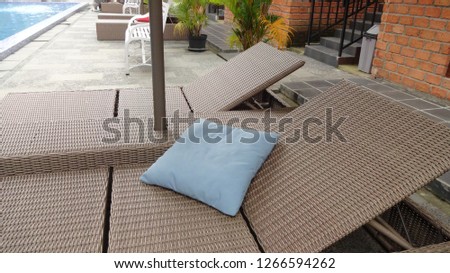 Lazy chairs next the swimming pool