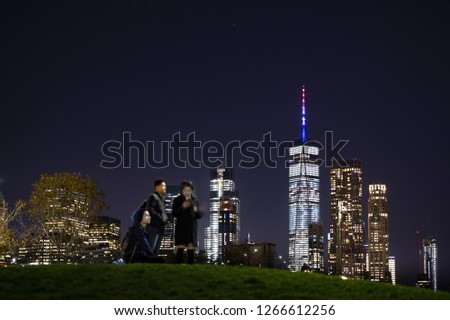 (Selective focus) Some tourists are enjoying the view of the beautiful Manatthan Skyline in New York, United States. Manhattan is the most densely populated borough of New York City, USA.