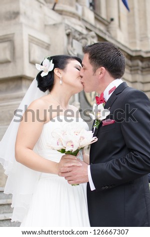 Happy in love newlyweds kissing