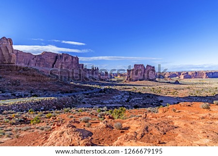 At sunset Arches National Park Arches Scenic Drive you see three gossips 