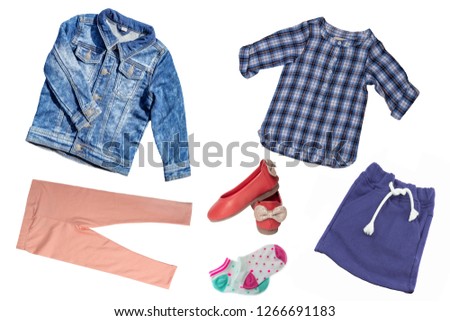 Top view on child girl set of clothes. Collage of apparel clothing. Skirts, sneaker, jeans, jacket, trousers and shirt isolated on a white background. Summer fashion.
