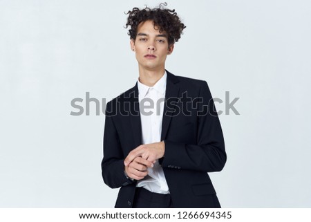 Curly guy in a business suit                    