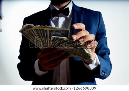 business man with bills in hand                