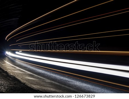 Car light trails in the tunnel. Very art image . Long exposure photo taken in a tunnel