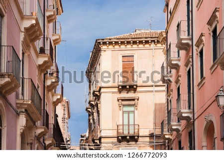 Travel to Italy -  historical street of Catania, Sicily, facade of ancient buildings