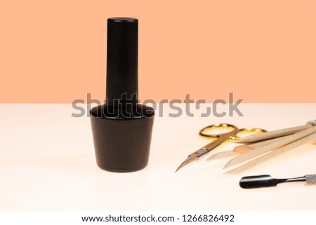 Tools of a manicure set on a white table. nail care