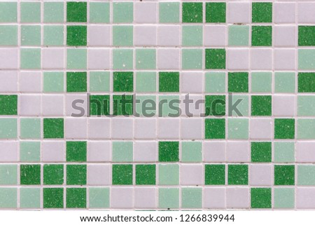 abstract square pixel mosaic wall background and texture. Green glass mosaic tile background pattern