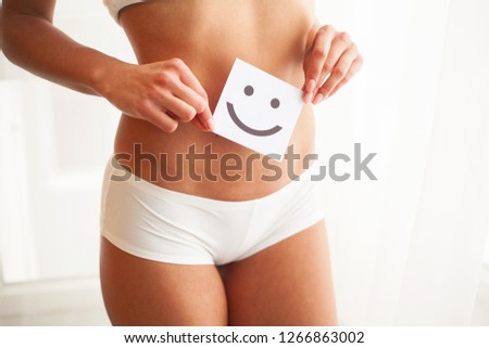 Women Health. Beautiful Female Body In Panties With Smile Card.
