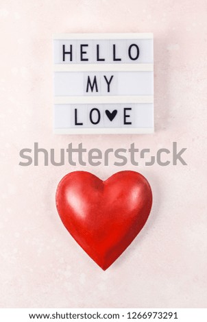 Creative Valentine Day romantic composition flat lay top view love holiday celebration with red heart lightbox pink background copy space Template greeting card text design social media blogs