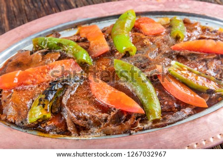 Iskender, translated as Alexander (the Great) Kebab is a well known ultra high calorie gourmet Turkish dish of Bursa made from high quality beef and typically enjoyed with yogurt and melted butter.