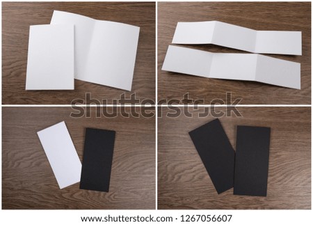 Set of booklets and flyers on wooden background