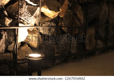 Steel grating to put stone into the interior wall of the restaurant With the use of light uplights to emphasize the lighting Royalty-Free Stock Photo #1267056862