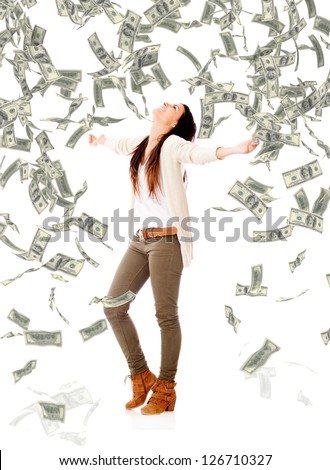 Excited woman under a money rain - isolated over a white background