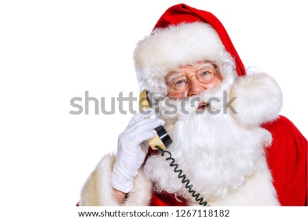 A portrait of Santa Claus with a telephone. Merry Christmas and Happy New Year!