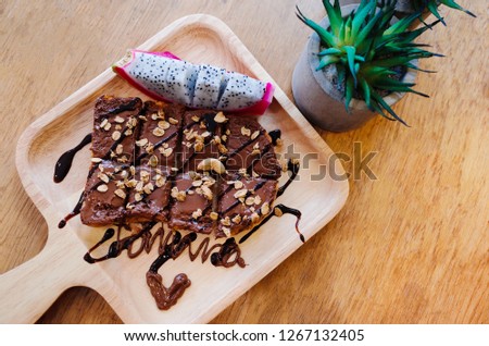 Chocolat bread slice shot on rustic wooden table.