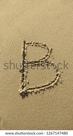 alphabet sand beach art writing