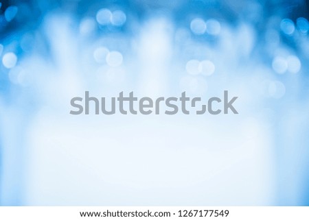 Stylish light blue background. Blurred glasses with bokeh