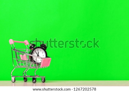 classic alarm clock in a shopping cart