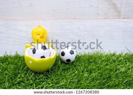 Soccer Happy Easter with Soccer  ball with football on green grass