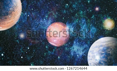 Stars of a planet and galaxy in a free space. Elements of this image furnished by NASA