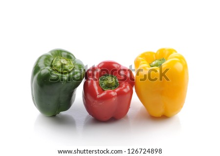 Sweet peppers of different colors, isolated against a white background