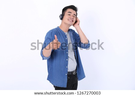 Asian man wearing hand listening