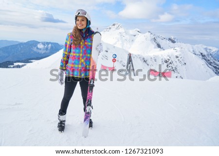              Happy Young Woman Skier Enjoying Sunny Weather In Alps Stock Photo                   