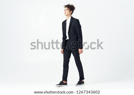 Cute curly business man in a suit                    