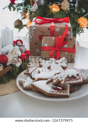 Christmas Gingerbread and Christmas Gifts. In background Christmas tree. Christmas decoration in home.
