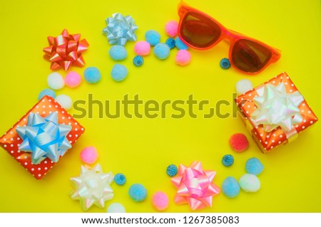 Happy birthday greeting card with gift box,glasses on yellow background with copy space