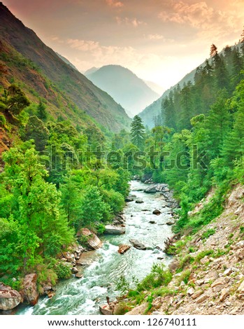 river flowing at the base of in deep mountain valley Royalty-Free Stock Photo #126740111