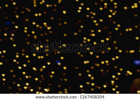 Blurred images of golden light bokeh with beautiful shapes on a black background.
Bokeh pictures, Christmas lights and New Year's Day celebrations are shaped by beautiful bokeh lights.