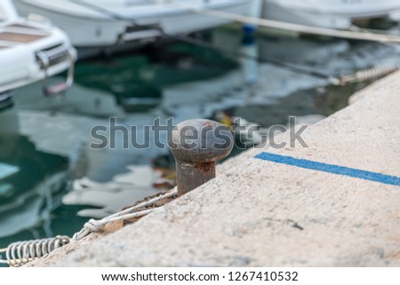 Metallic mooring in a port prepared for the mooring of a yacht