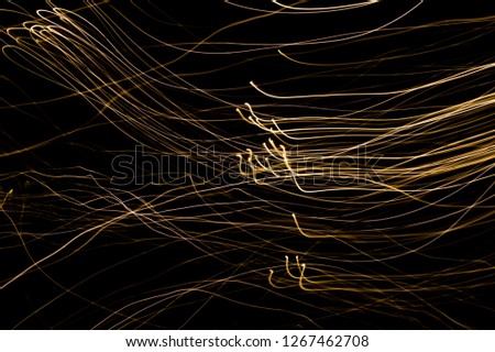 Abstract background of long explosure tale golden light