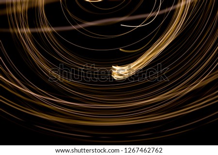 Abstract background of long explosure tale golden light