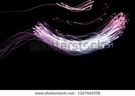Abstract background of long explosure tale purple and blue light