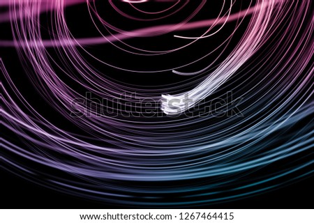 Abstract background of long explosure tale purple and blue light
