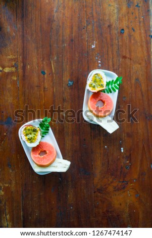 papaya and passion fruit on plate