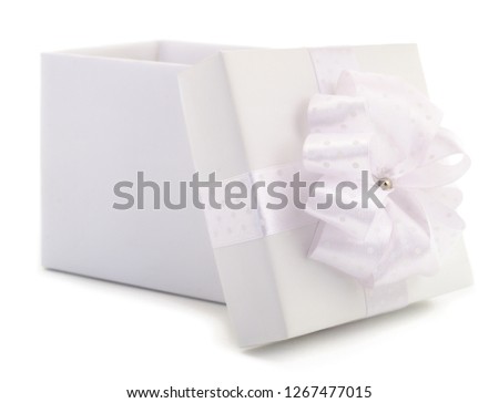 White gift box with white ribbon isolated on white color background