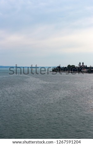 stormy weather at lake constance in bavaria south germany and mountains on the horizon