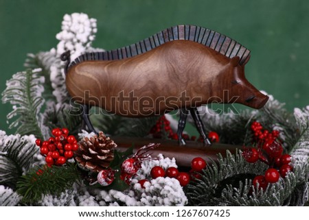 Pig on the green background Xmas tree 