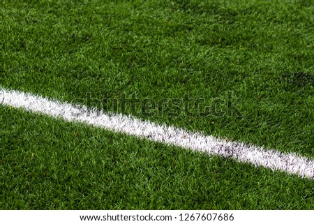 GREEN GRASS OF FOOTBALL FIELD AND WHITE LINE Royalty-Free Stock Photo #1267607686
