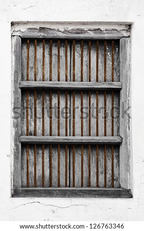 Old wooden grunge window with rusty grate
