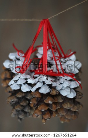 Christmas pine cones hanging from red ribbons. Happy New Year. Perfect happy new year pictures. Excited to Send Happy New Year Wishes to Family and Friends, Lover. Naturally. 