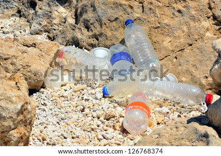 plastic bottles on the beach Royalty-Free Stock Photo #126768374