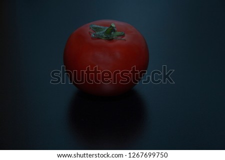 Tomato in black table  