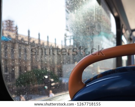 Houses of Parliament, Westminster, London, out of focus through a dirty bus window